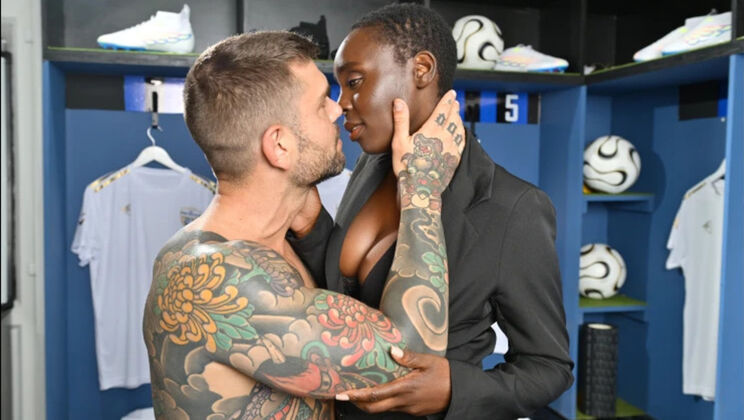 Juan Lucho and Zaawaadi caress in the hairy locker room